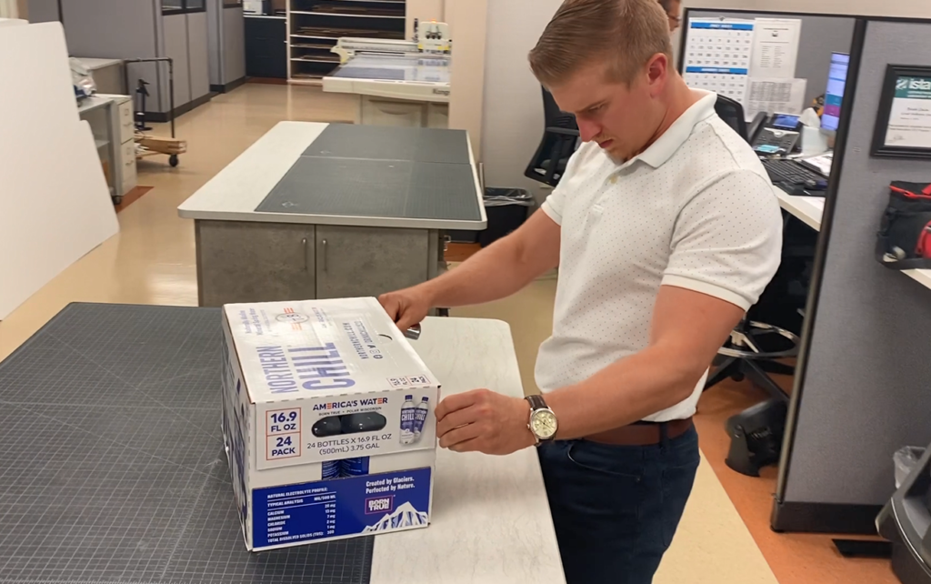 GNC team testing custom packaging solutions